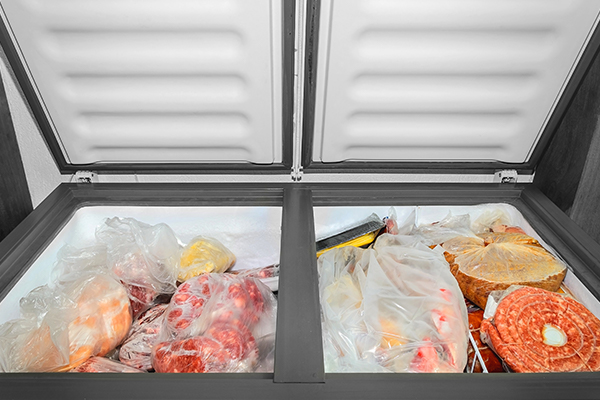 Fridge full of frozen meat.