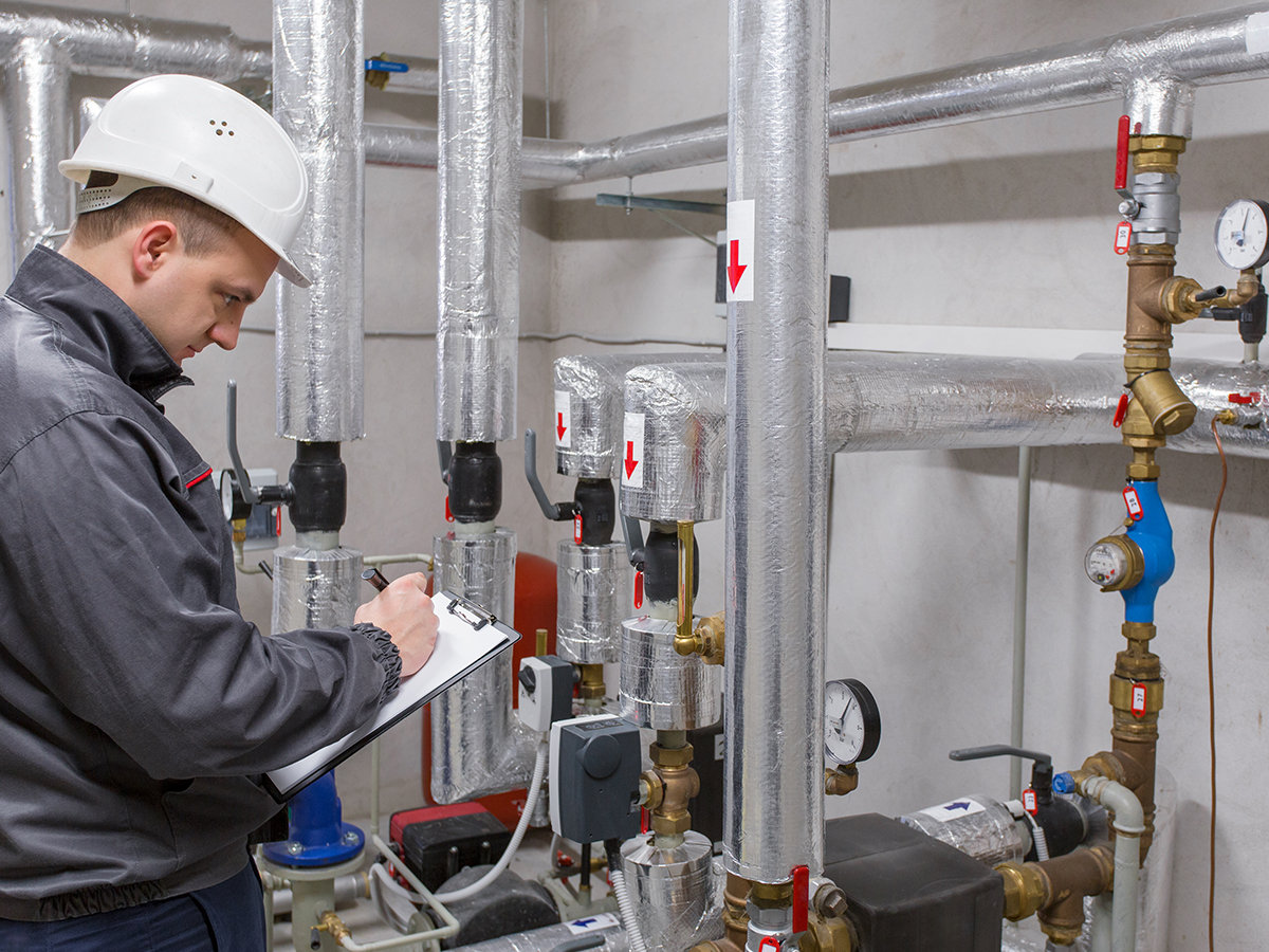 man working on a heater system