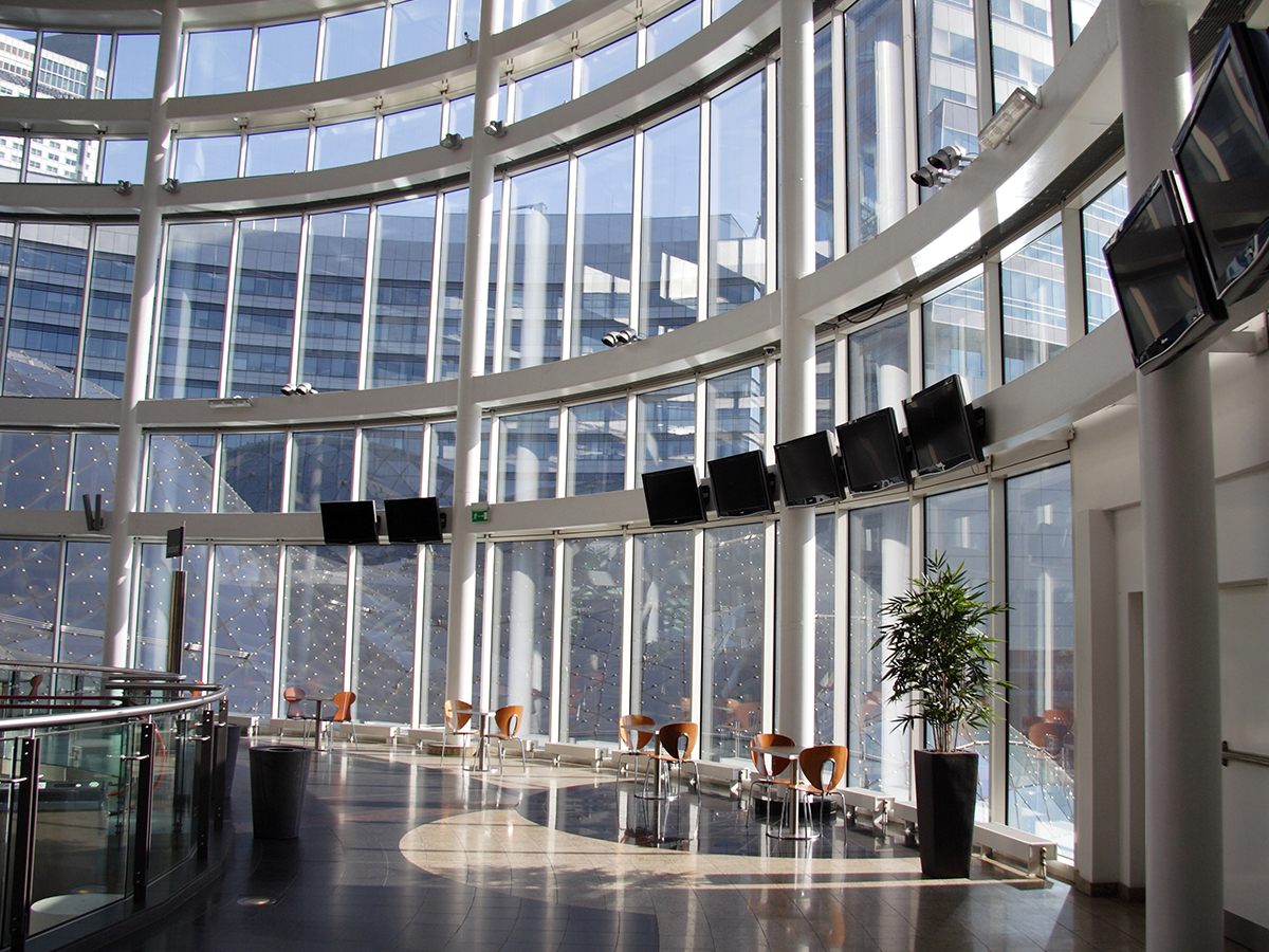 Large room with tall glass windows