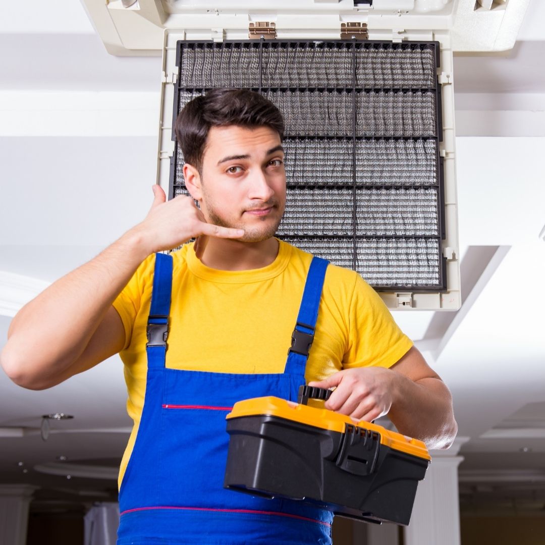 HVAC tech making a phone gesture