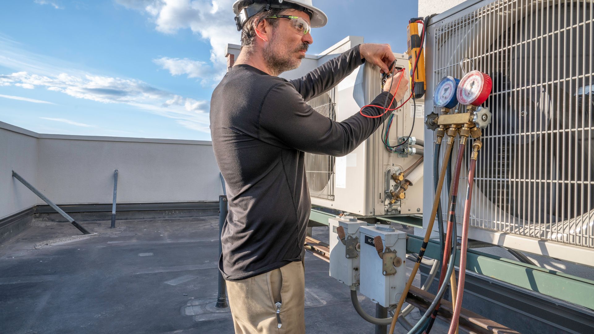 Man working on HVAC unit