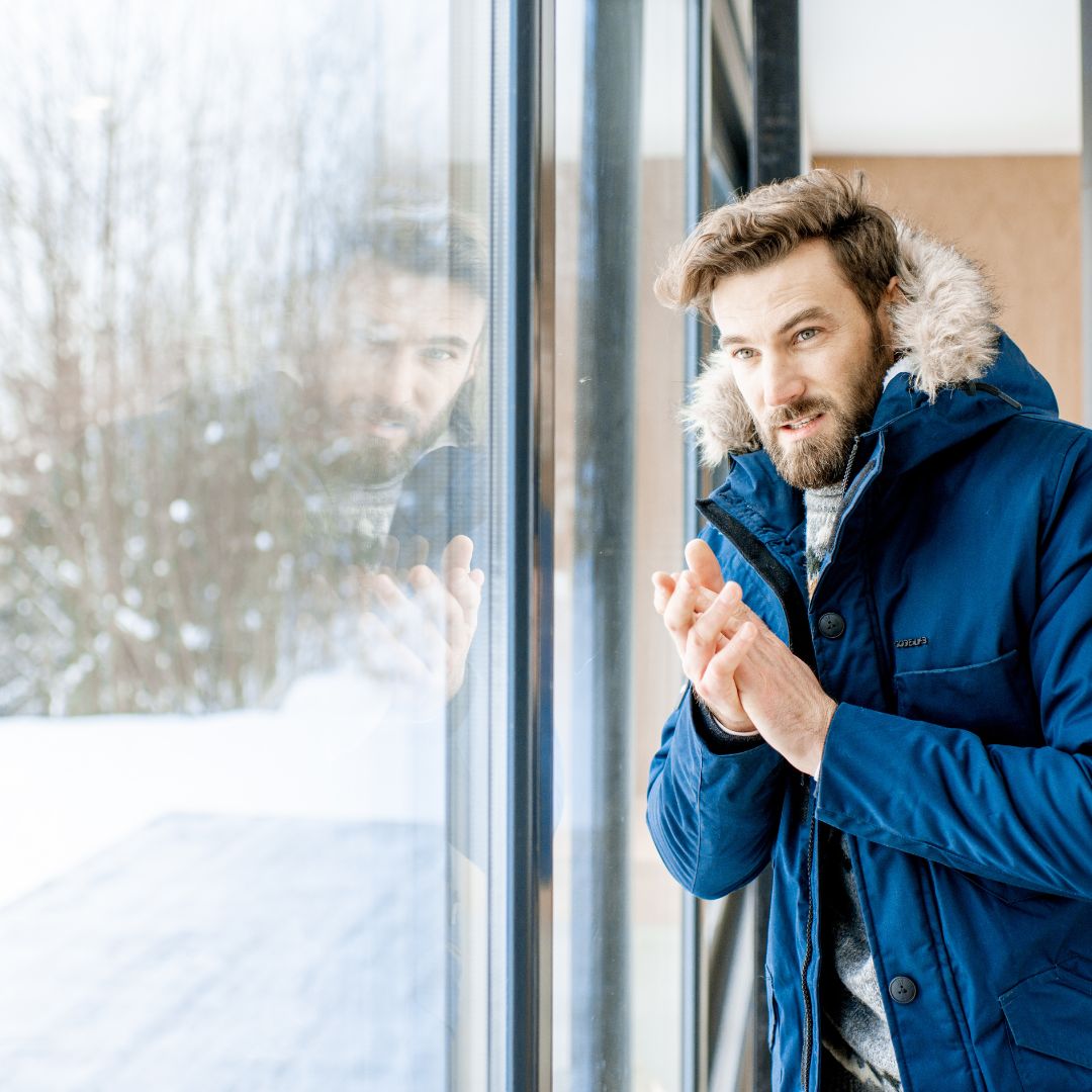 person wearing their coat inside