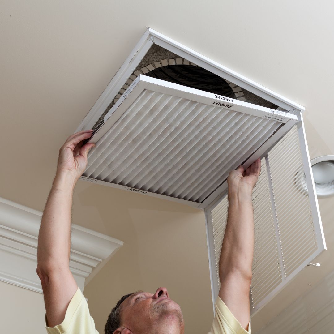 HVAC tech working on central air