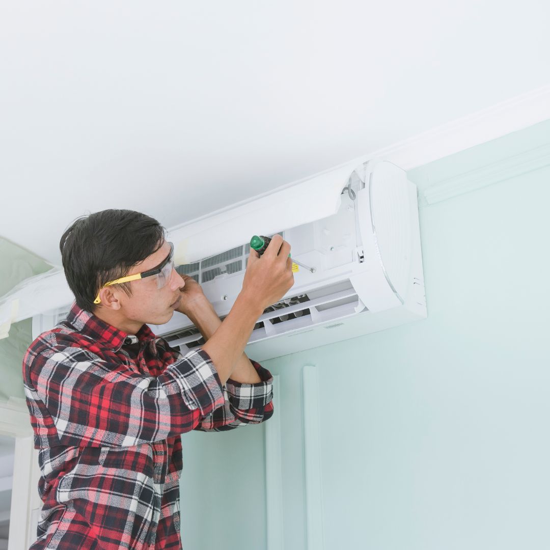 person working on AC