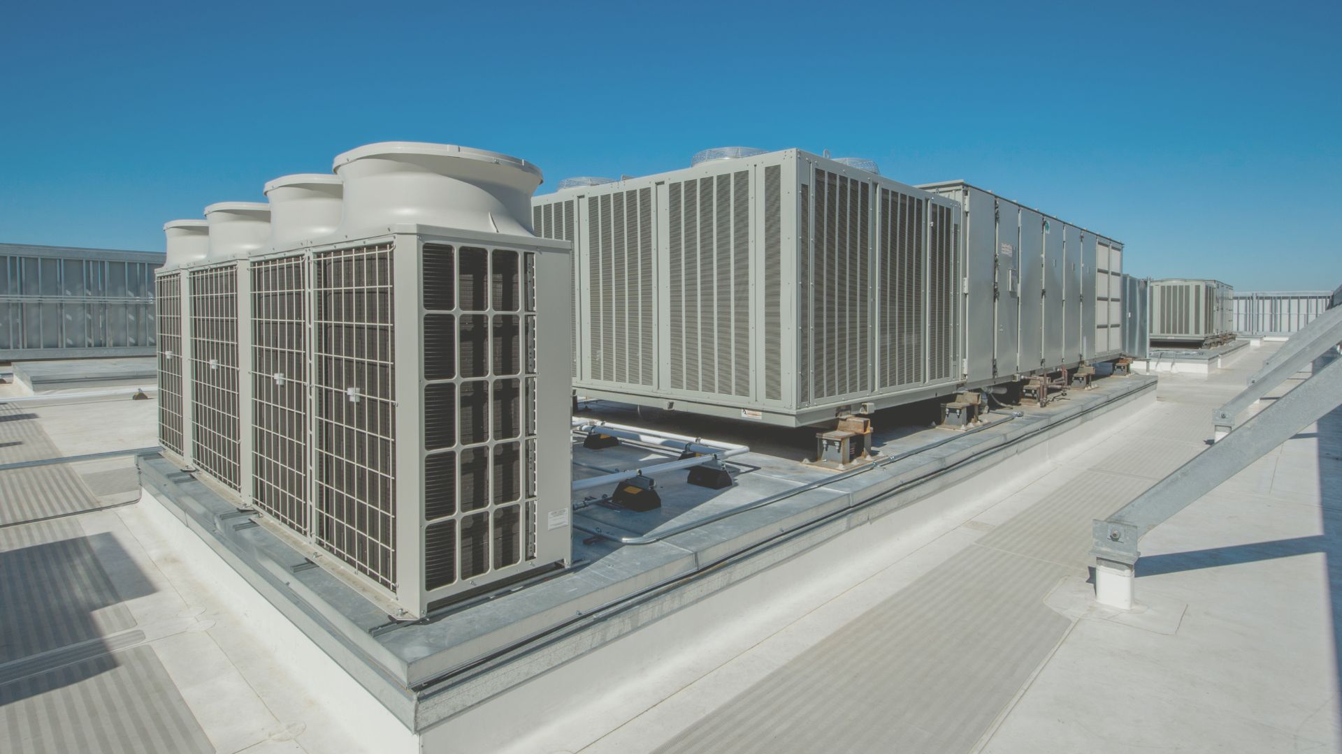 Commercial HVAC units on rooftop.