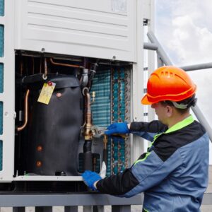 hvac technician repairing commercial hvac unit