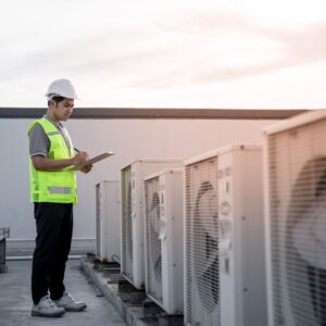hvac technician inspecting commercial unit