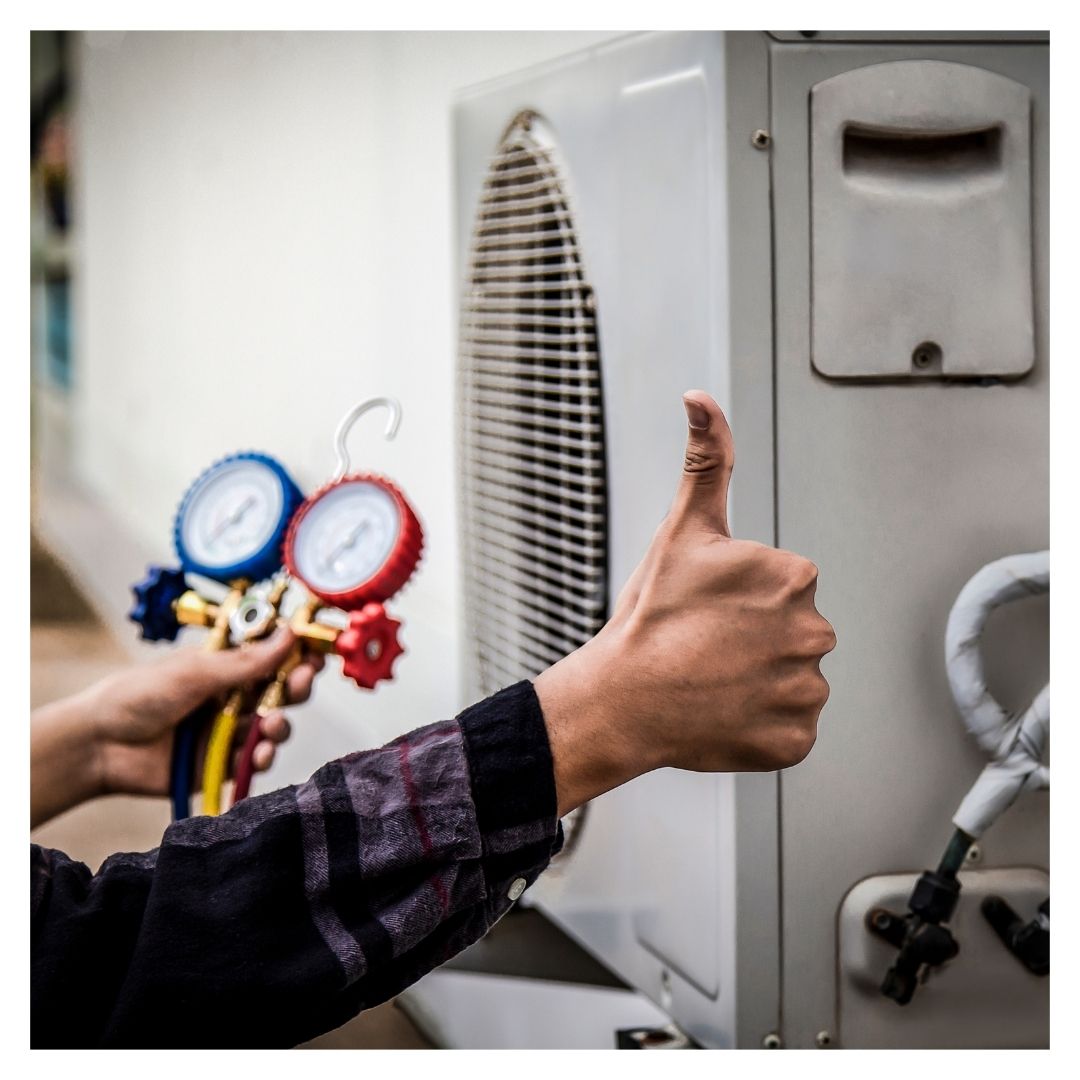 HVAC technician giving a thumbs-up