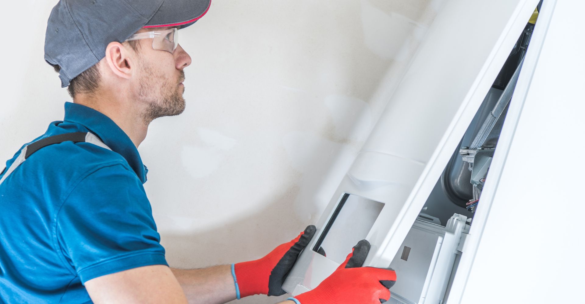 HVAC tech working on heater