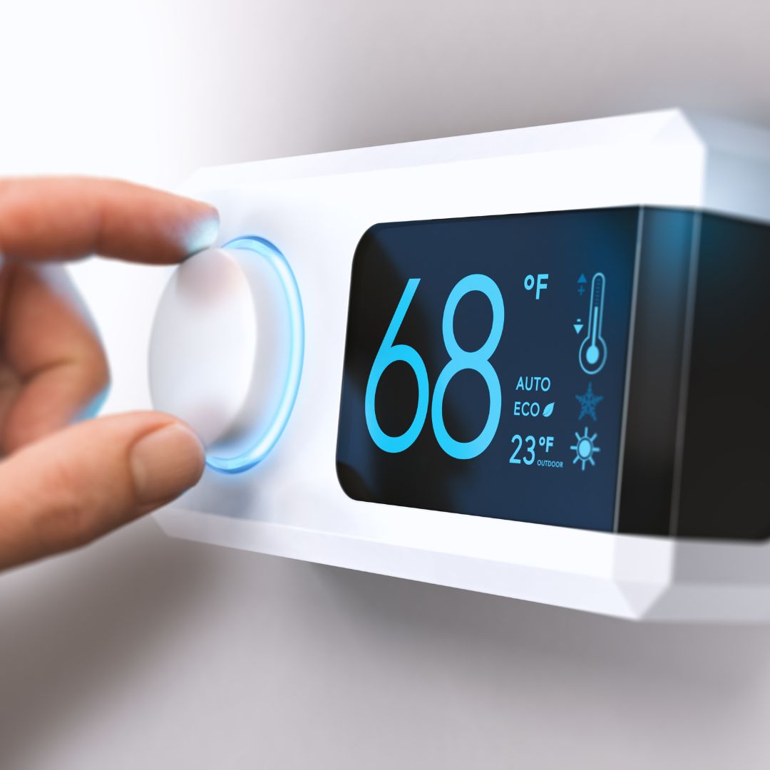 hand setting smart thermostat to 68f